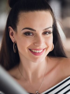 Beautiful woman with a radiant morning smile in a natural close-up portrait